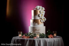 white and golden Indian wedding cake decoration. white and golden Indian wedding cake decoration.