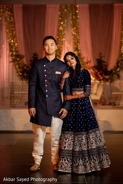 Indian couple posing at reception venue. Indian couple posing at reception venue.