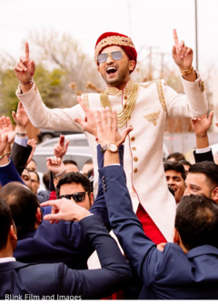 Indian groom carried in shoulders during Baraat Indian groom carried in shoulders during Baraat