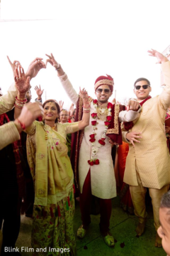 Indian groom and Indian relatives dancing during the Baraat Indian groom and Indian relatives dancing during the Baraat