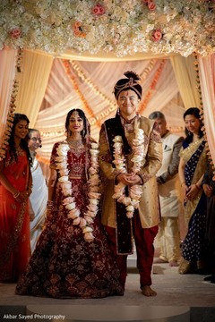 Indian couple with their ceremony jaimala roses garlands. Indian couple with their ceremony jaimala roses garlands.
