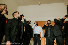 Indian groom and groomsmen having a toast on Pocket Flask. Indian groom and groomsmen having a toast on Pocket Flask.