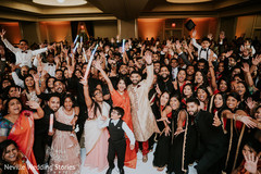 Indian couple with Indian wedding guests photography. Indian couple with Indian wedding guests photography.