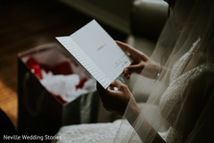 Indian bride reading indian groom's card. Indian bride reading indian groom's card.