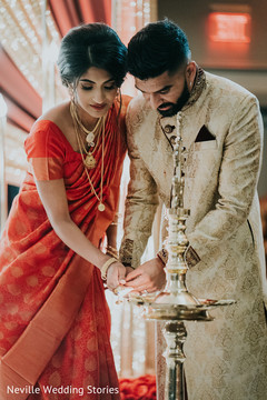 Indian bride and groom lighting up the sacred fire. Indian bride and groom lighting up the sacred fire.