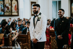 Indian groom walking in down the wedding ceremony aisle. Indian groom walking in down the wedding ceremony aisle.