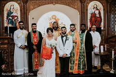 Indian couple posing with priest at wedding ceremony church. Indian couple posing with priest at wedding ceremony church.