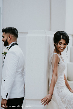 Indian bride and groom posing on their christian wedding outfits. Indian bride and groom posing on their christian wedding outfits.
