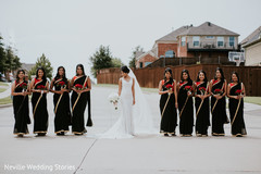 Indian bride in the middle of bridesmaids photo session. Indian bride in the middle of bridesmaids photo session.