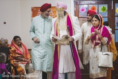 Indian groom and Indian relatives walking down the aisle Indian groom and Indian relatives walking down the aisle