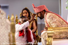 Indian groom receiving the priest blessing. Indian groom receiving the priest blessing.