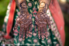 Indian bride showing er mehndi art. Indian bride showing er mehndi art.