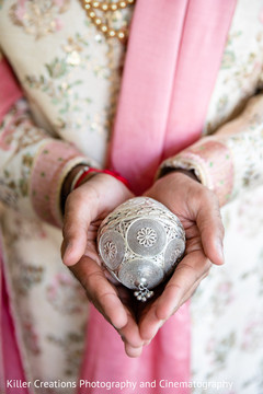 Indian groom holding an Indian item. Indian groom holding an Indian item.