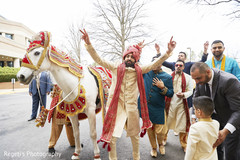 Indian groom dancing besides his horse during baraat. Indian groom dancing besides his horse during baraat.