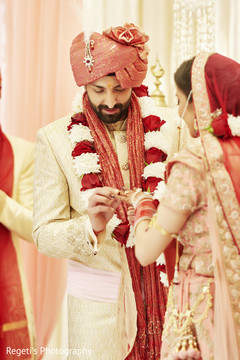 Indian groom putting ring on his Maharani. Indian groom putting ring on his Maharani.