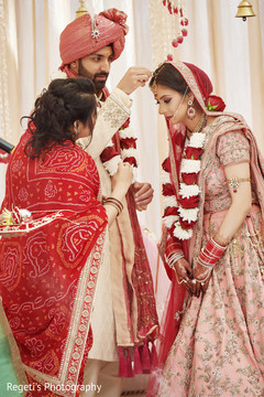 Indian groom putting jewel on his Maharani. Indian groom putting jewel on his Maharani.
