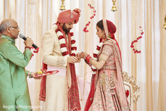 Indian couple exchanging rings. Indian couple exchanging rings.