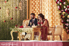 Indian couple being amused during their reception. Indian couple being amused during their reception.
