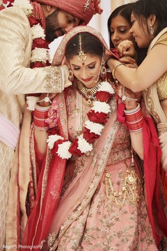 Maharani being assisted with her garland. Maharani being assisted with her garland.