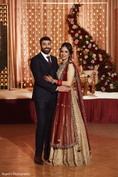 Indian couple in formal wear posing for picture. Indian couple in formal wear posing for picture.