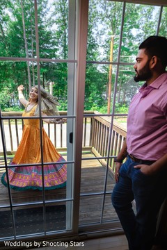 Indian groom whatching his Maharani dancing on the balcony Indian groom whatching his Maharani dancing on the balcony