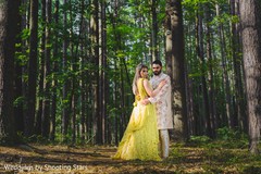 Indian couple embracing and looking at the camera Indian couple embracing and looking at the camera