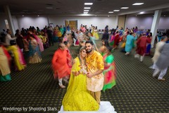 Indian couple embracing on the dance-floor Indian couple embracing on the dance-floor