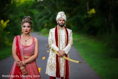 Indian couple posing on a forest road Indian couple posing on a forest road