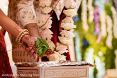 Indian couple joining hands during a rite Indian couple joining hands during a rite