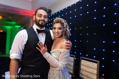 Indian newlyweds posing on stage Indian newlyweds posing on stage