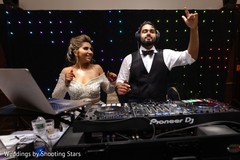Indian groom and Maharani taking over the DJ turntables Indian groom and Maharani taking over the DJ turntables