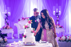 Indian Bride and Groom Cutting Cake Indian Bride and Groom Cutting Cake