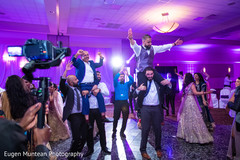 Indian guests and groom dancing at reception celebration Indian guests and groom dancing at reception celebration
