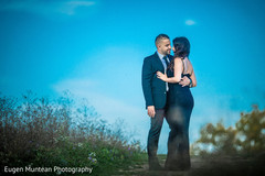 Indian newlyweds staring at each other during photo shoot Indian newlyweds staring at each other during photo shoot