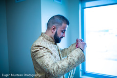 Indian groom putting on his mala neklace. Indian groom putting on his mala neklace.