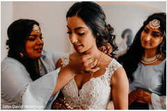 Indian bride getting her wedding ceremony jewelry on. Indian bride getting her wedding ceremony jewelry on.