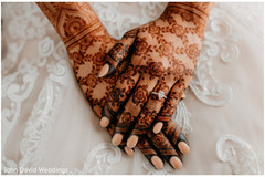 Indian bride with flowers on her mehndi art. Indian bride with flowers on her mehndi art.