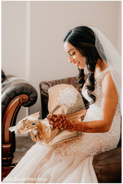 Maharani opening her wedding present. Maharani opening her wedding present.