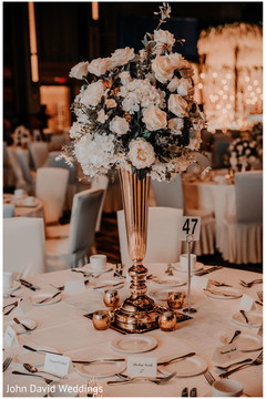 Indian wedding reception table bronze centerpiece decoration. Indian wedding reception table bronze centerpiece decoration.