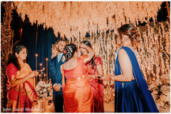 Indian bride getting the red dot on forehead ritual. Indian bride getting the red dot on forehead ritual.