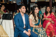 Indian newlyweds smiling during reception Indian newlyweds smiling during reception