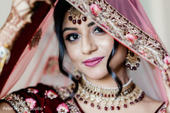 Indian bride with her pink ghoonghat over her head. Indian bride with her pink ghoonghat over her head.