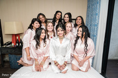 Indian bride with bridesmaids posing when getting ready. Indian bride with bridesmaids posing when getting ready.