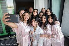 Indian bride with bridesmaids getting a selfie. Indian bride with bridesmaids getting a selfie.