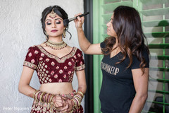 Indian bride getting her makeup on. Indian bride getting her makeup on.