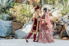 Indian bride and groom holding hands outdoors. Indian bride and groom holding hands outdoors.