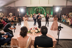 Indian groomsmen and bridesmaids performing a choreography Indian groomsmen and bridesmaids performing a choreography