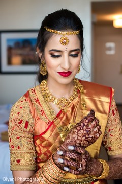 Indian bride putting one her chooras. Indian bride putting one her chooras.