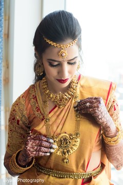 Maharani putting on her wedding ceremony jewelry. Maharani putting on her wedding ceremony jewelry.