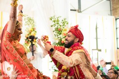 Indian groom putting the garland to bride ritual. Indian groom putting the garland to bride ritual.